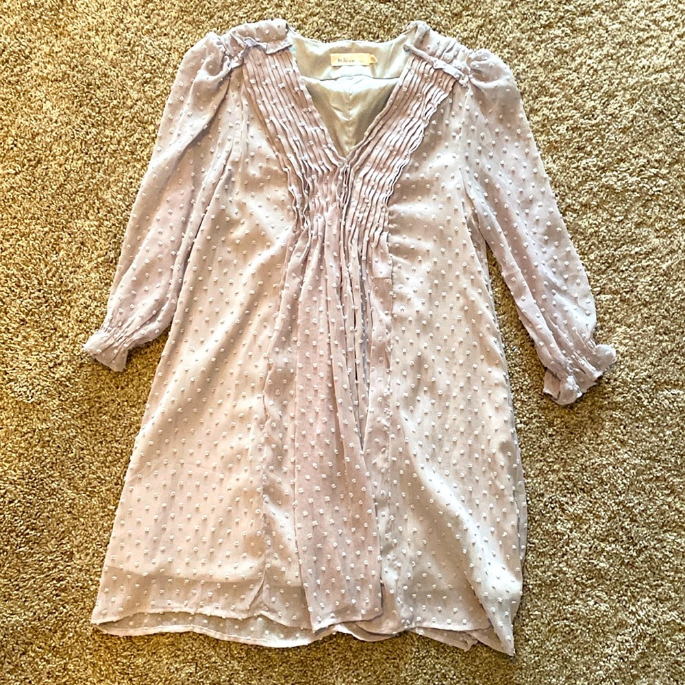 Gray boutique mini dress. Flowy, stitched dots and elegant ruffled v-neck.